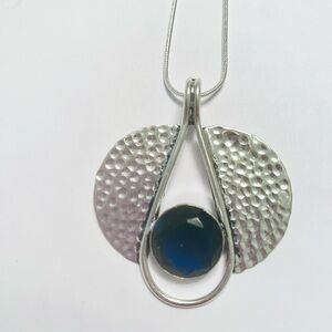 Beautiful, 2 inch, 925 marked, Tanzanite, pendant on a silver chain.